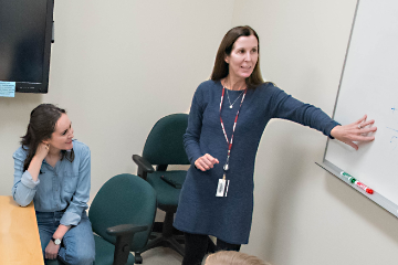 Faculty member provides instruction to a class of students 