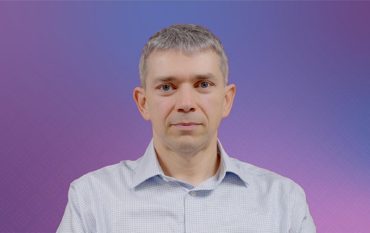 David Anastasiu in front of purple backdrop