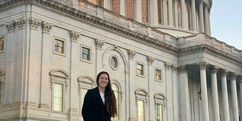 Political Sceience and Philosphy double major Ariana Yamasaki with the U.S. Capitol in the background. 