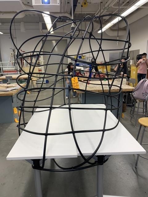 Art object of tubes on table