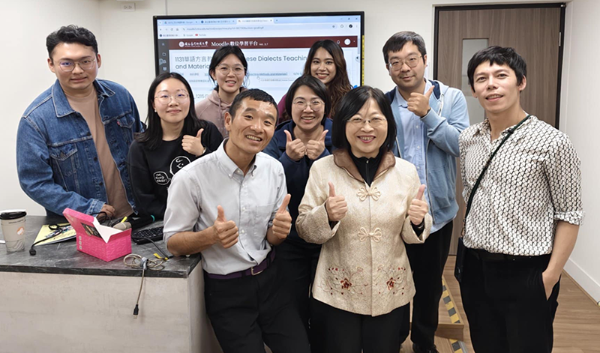 Group photo of Sean Yeh and Colleagues in a classroom.