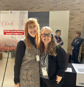 Heather Turner and Emma Rose at a conference