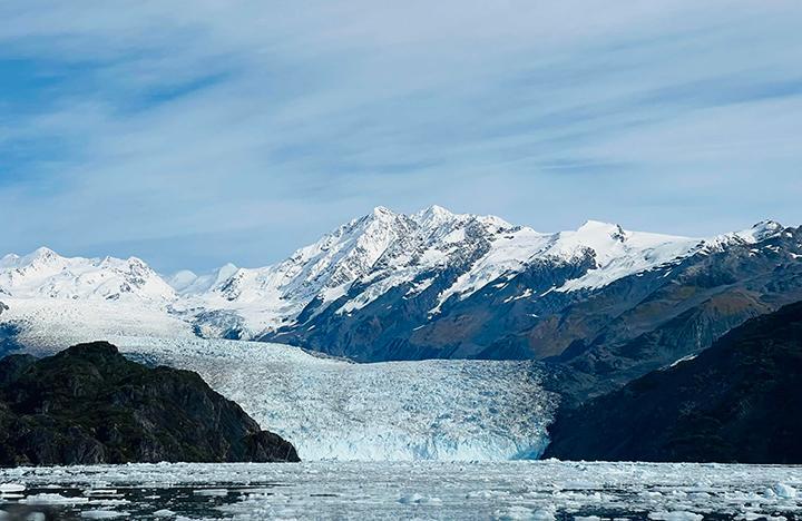An Alaskan glacier amongst mountains