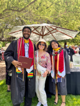    Elsa with undergraduate research assistants Chisomaga Nlembigo '25 and Sam Campos '25 at commencement, June 2025.