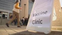 Alt text: Outdoor scene with a sign titled 