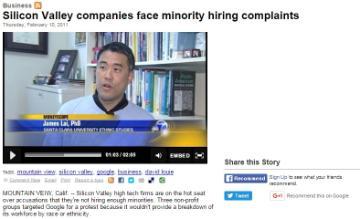Alt text:  
Man speaking in a news interview about Lai minority hiring complaints, text on screen with subtitles.