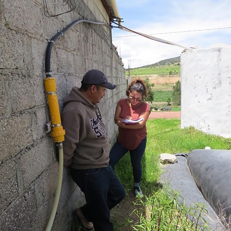 Julieta is interviewing a customer on his farm in Tlaxcala
