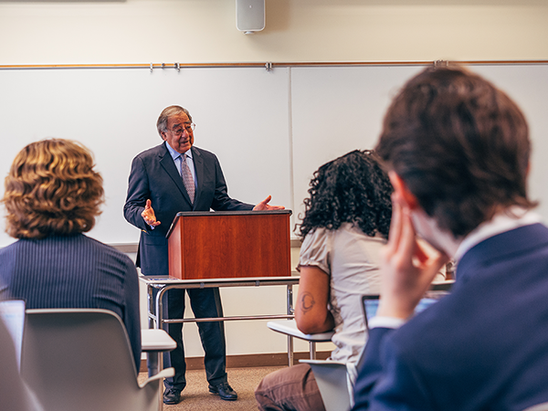 Leon Panetta lecturing students in a classroom.
