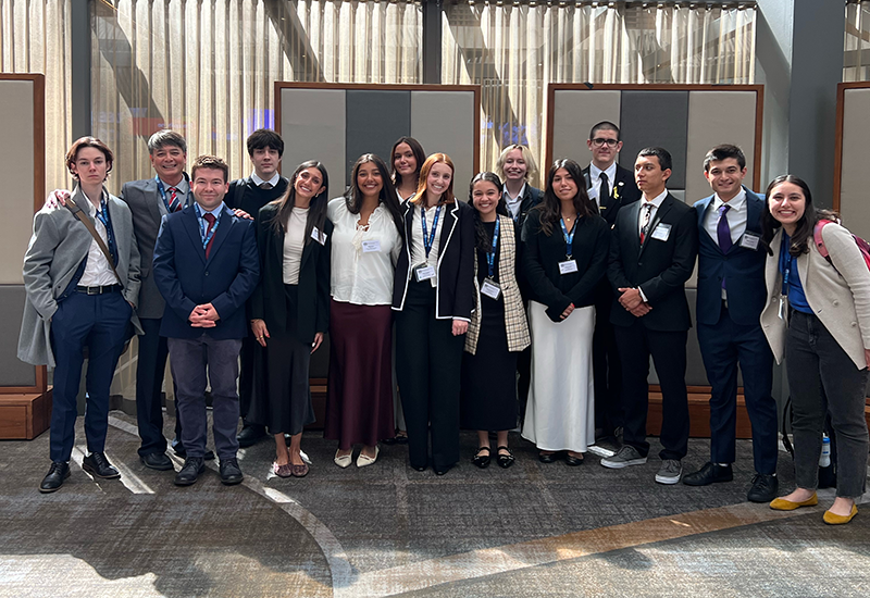 Group photo of Kenneth Faulve-Montojo and Model United Nations students.