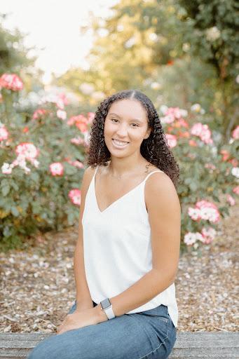 Amana Liddell in front of flowers