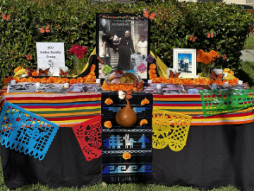colorfully decorated table with phots of loved one
