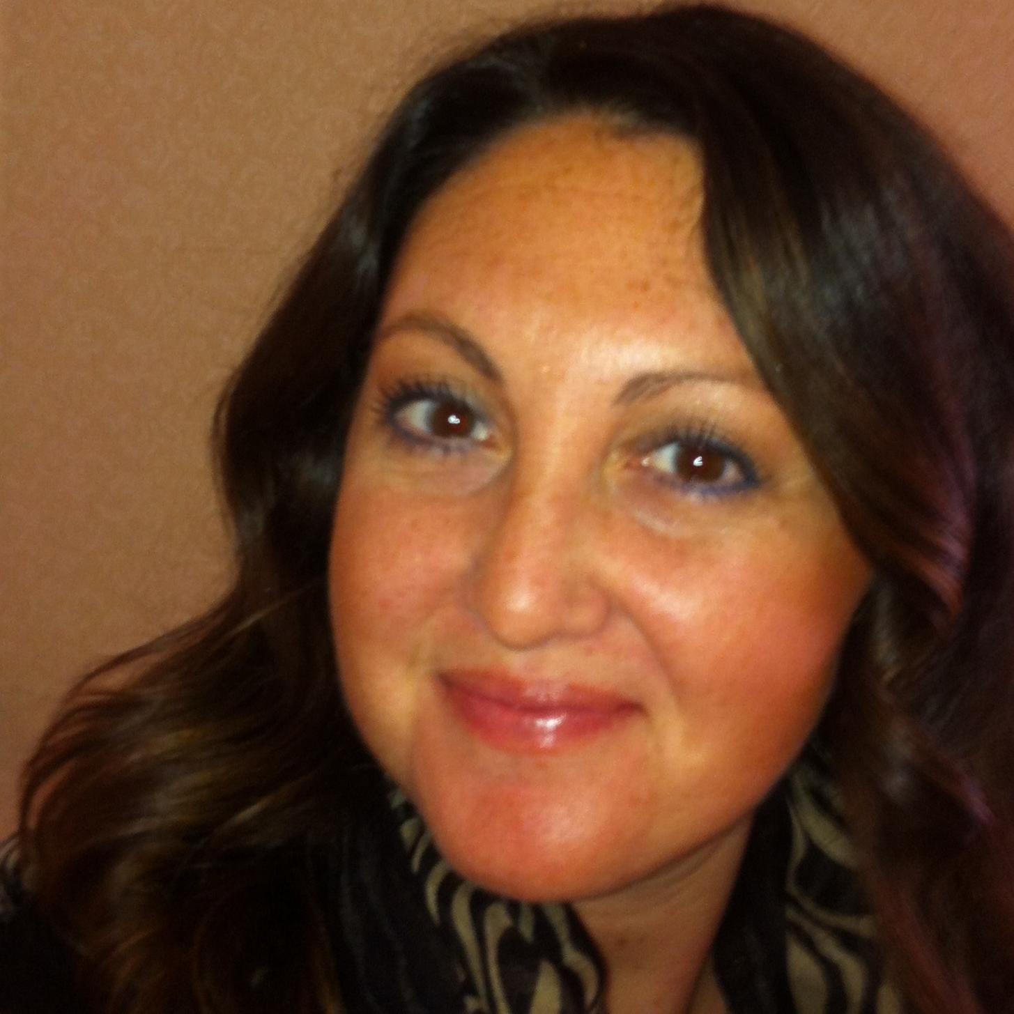 A woman smiling at the camera.