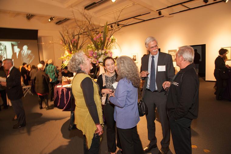 Group of animated people talking and laughing.