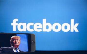 Facebook logo with a small image of Donald Trump speaking.
