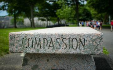 Gray, concrete tombstone with no people. 