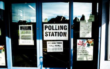Door for polling station covered with polling related signage