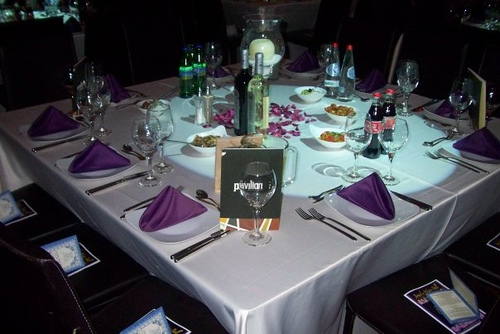 Dinner table set with tablecloth and napkins