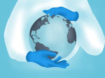 Healthcare worker holding a globe. 