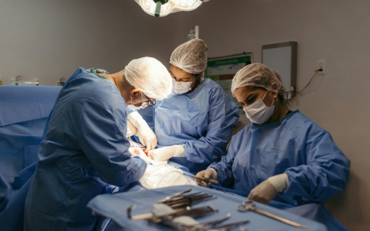 A group of doctors performing surgery in a hospital