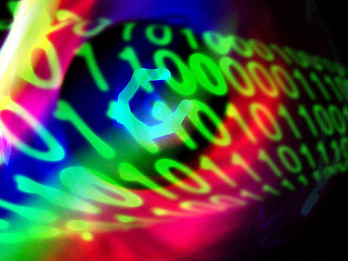 Alt text: Colorful binary code representing cybersecurity.