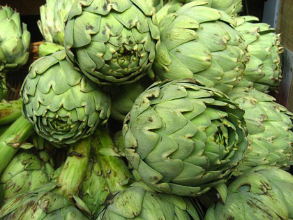 Green artichokes clustered together.