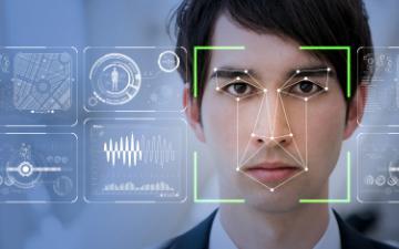 A person being scanned by facial recognition technology systems. 