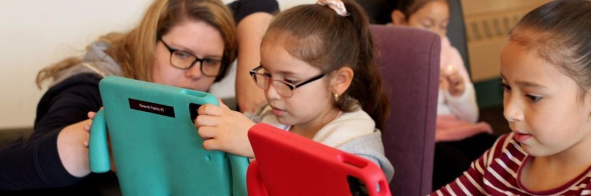 Thriving Neighbors Banner - students in iPad program 