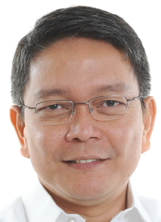 Alt text: Man wearing glasses smiling at the camera. image link to story