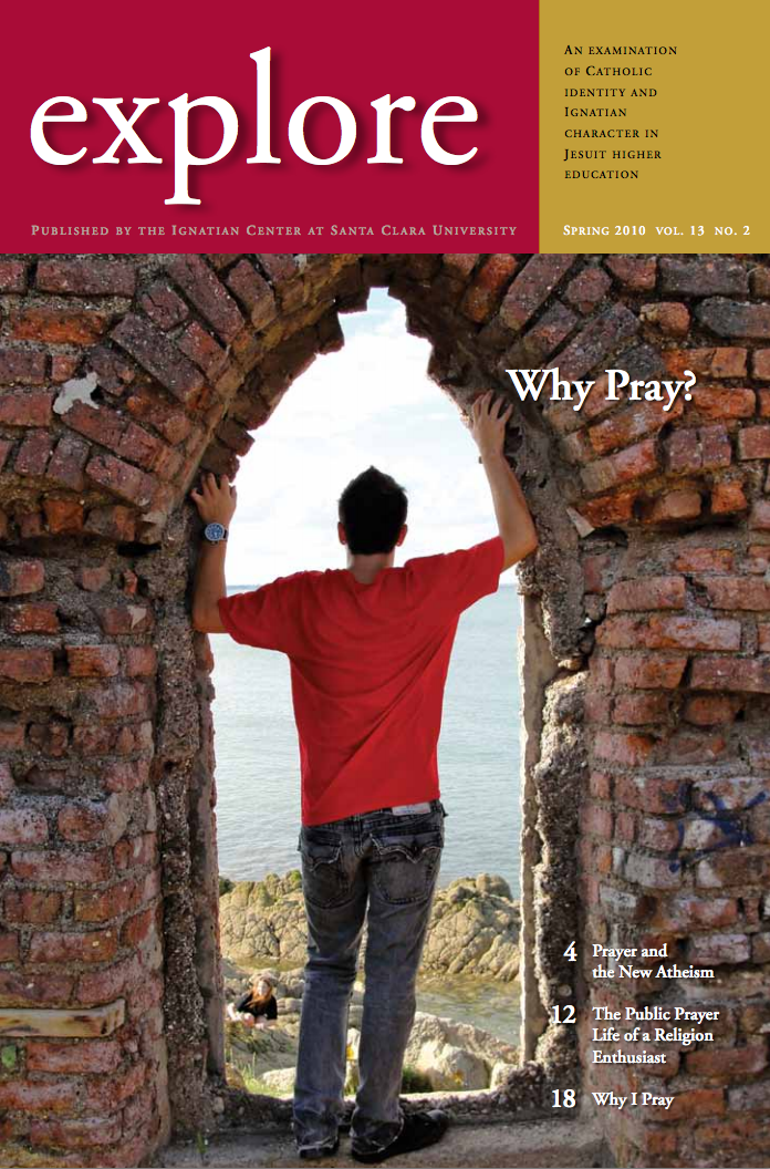 A person standing in a stone archway with 