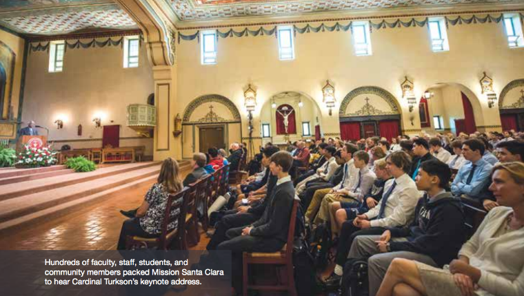 People attending an event in a large, ornate church.