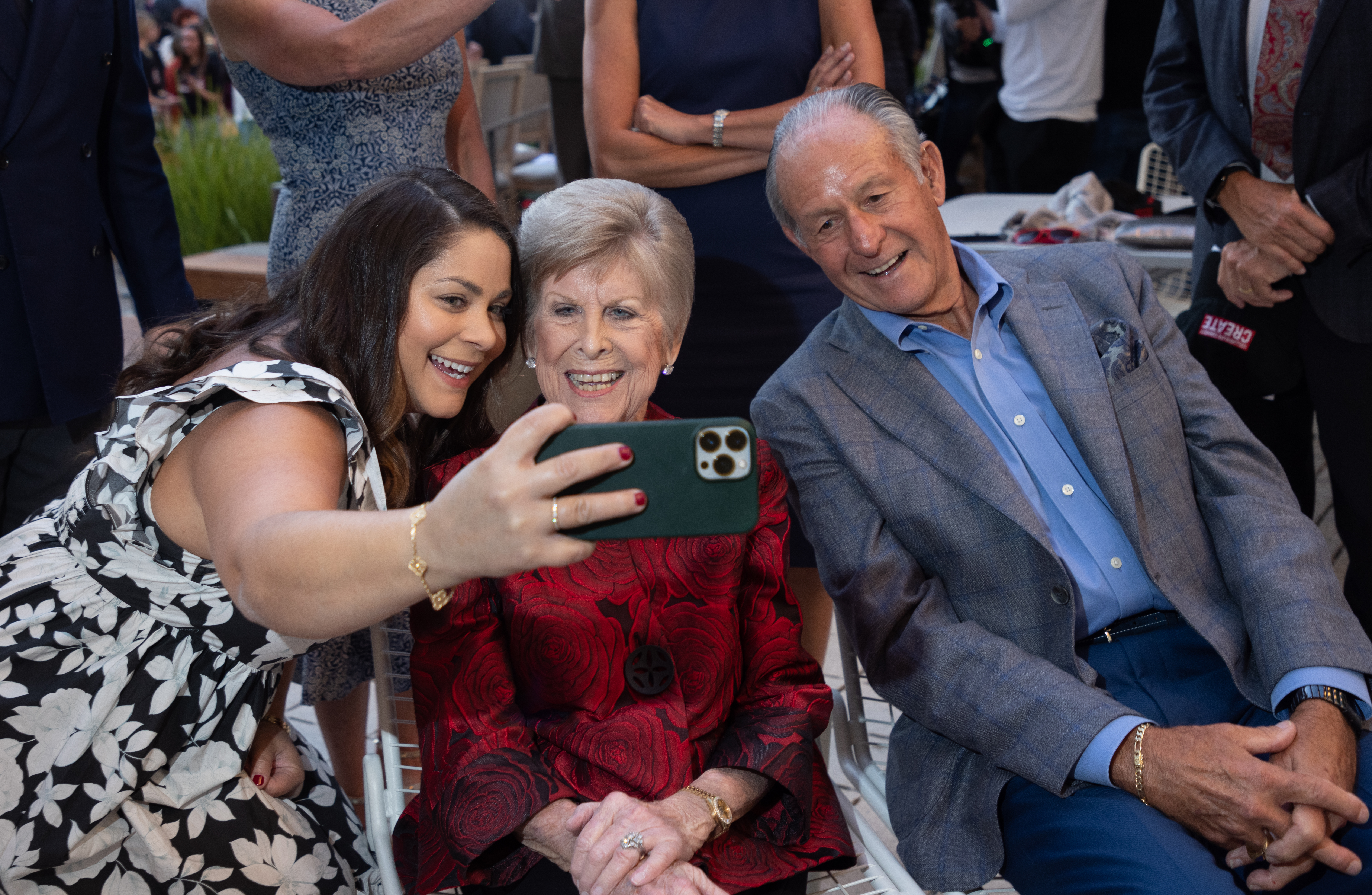 Three people taking a group selfie outdoors at the SCDI Dedication.