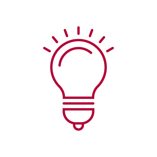 Icon of a red light bulb with rays emanating outward.