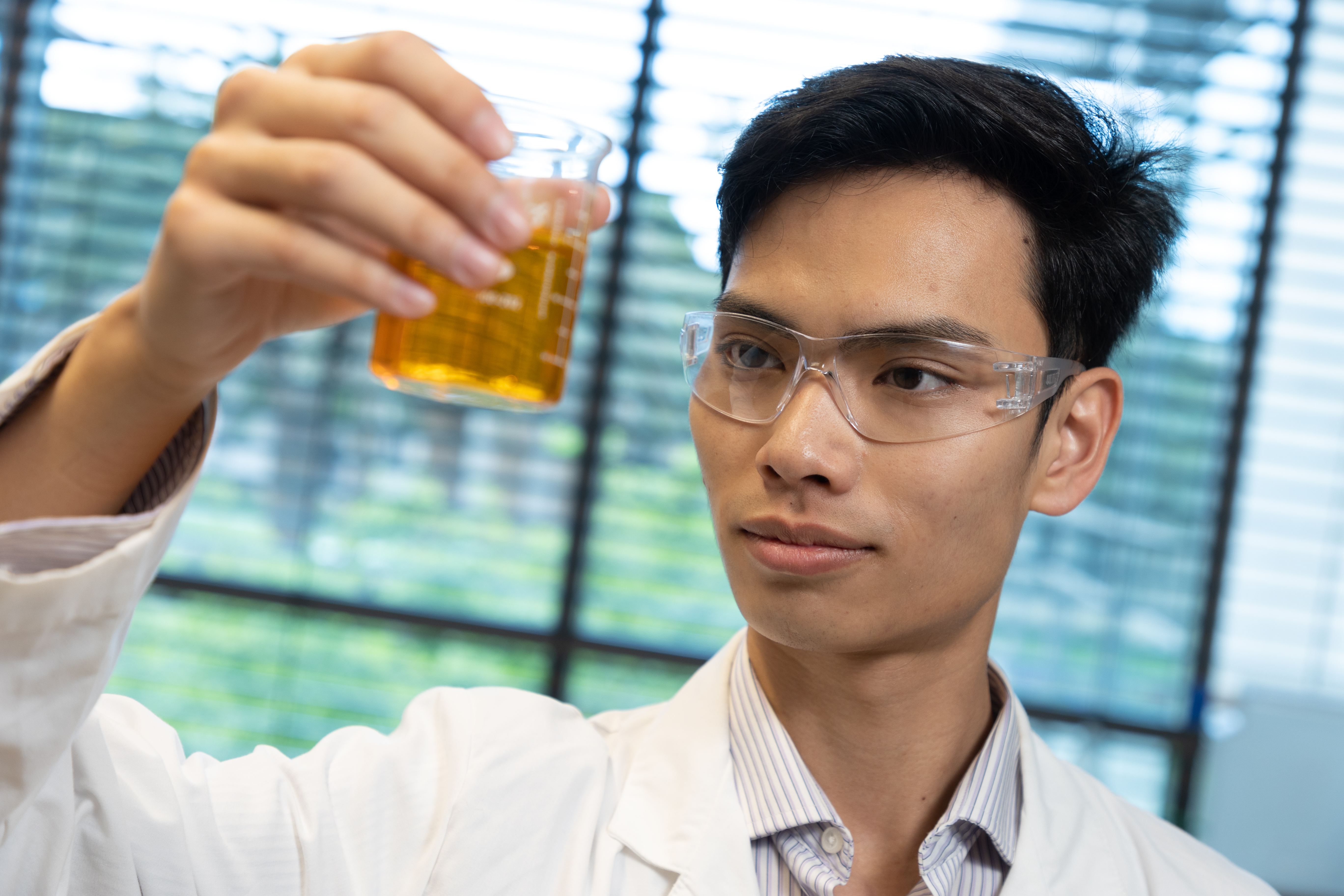 An Doan '24 pictured in a lab at Santa Clara