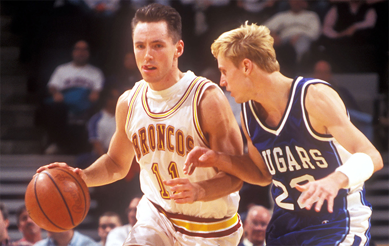 Steve Nash drives past defender