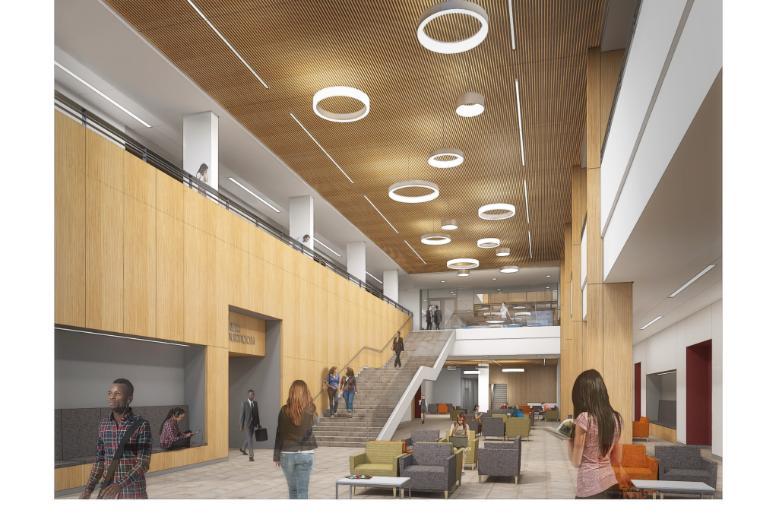 Modern classroom with staircase, study areas, and overhead lighting, titled 'Charney Classroom Court.' image link to story