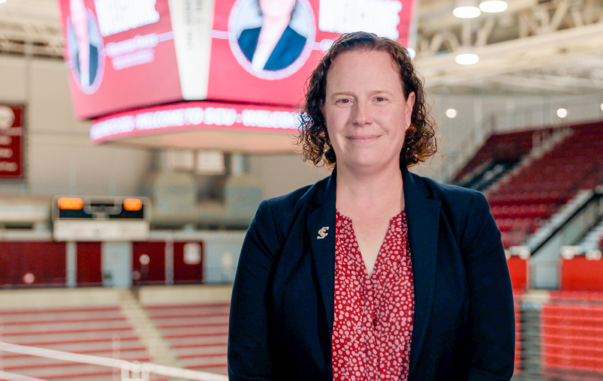 Heather Owen stands in Leavey Center at the top level