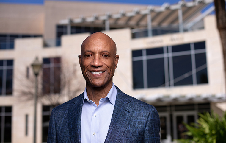 Dean Ed Grier in front of Leavey School image link to story