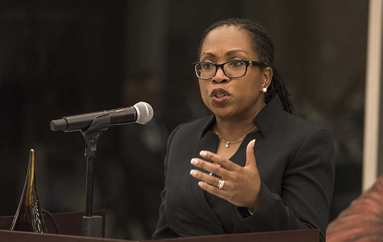 Ketanji Brown Jackson speaks at a podium and microphone