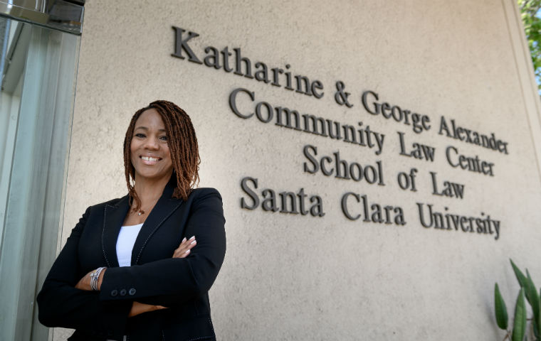 ED Deborah Moss West in front of SCU Law's Alexander Law Center