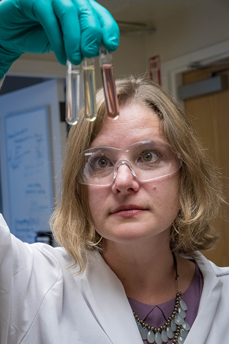 Korin Wheeler holding test tubes