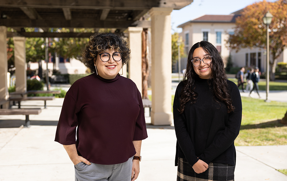 Alice Villatoro and Delilah Garza stand outside of Kenna Hall