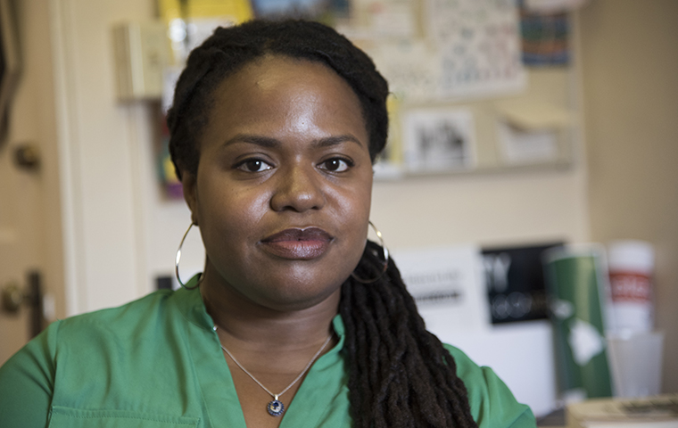 Robin Nelson sits in her office