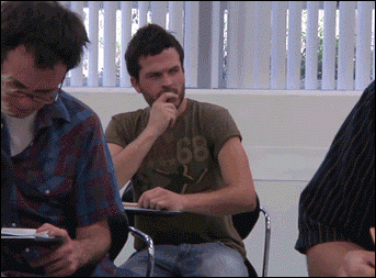 Student looks at hand to see encouraging message