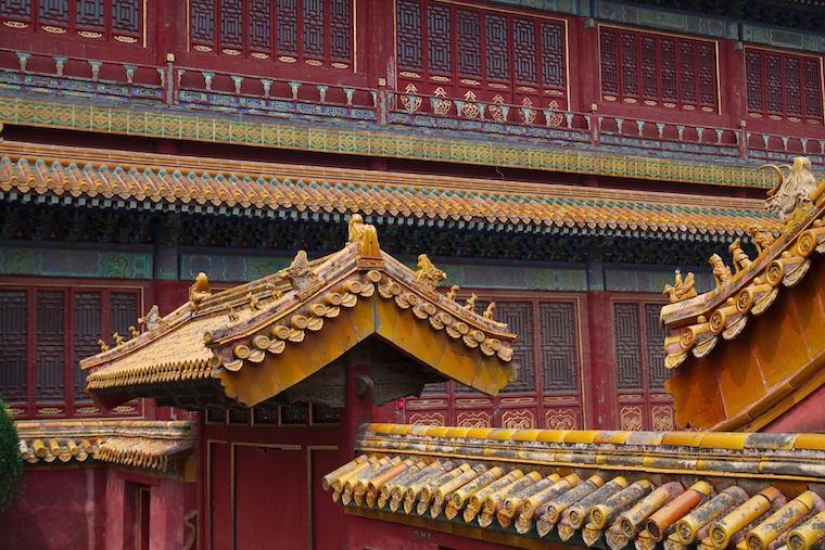 Ornate rooftop details of traditional Chinese architecture in Beijing. image link to story