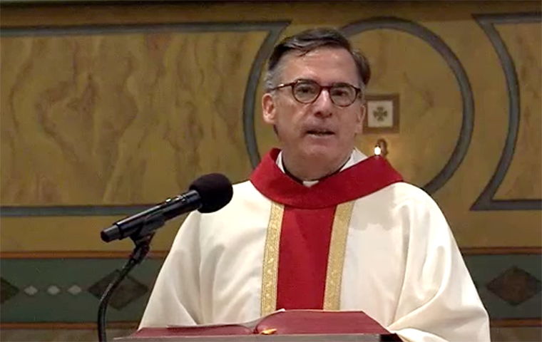 Kevin O'Brien, S.J., giving a homily at founders day