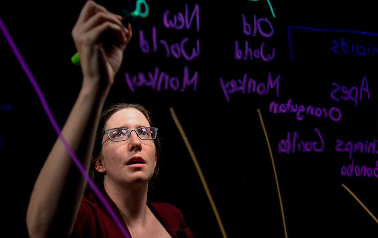 Tanya Chiykowski-Rathke writes on a lightboard