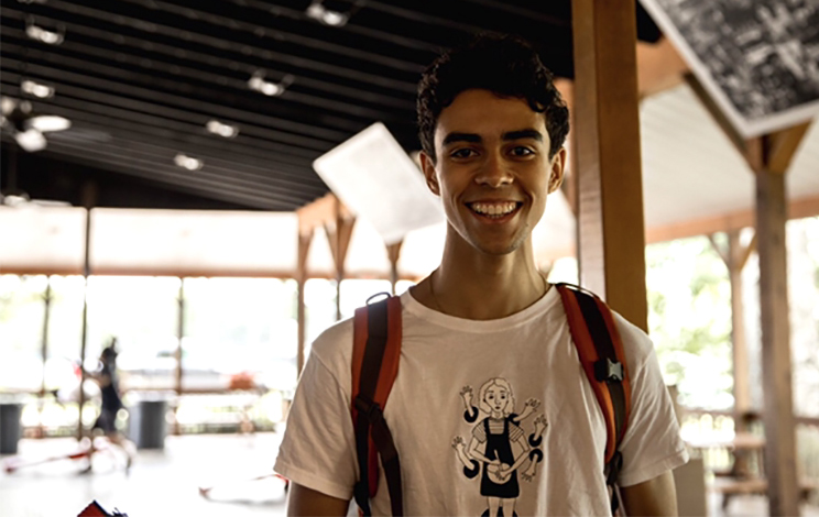 Oliver Branham-Upton stands in a room