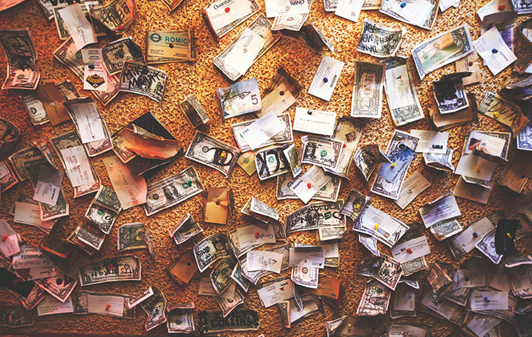 Dollar bills pinned to the ceiling of The Hut