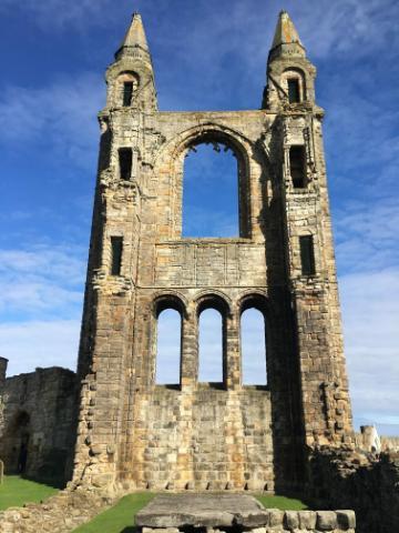 Alt text: Ruins of St. Andrews Shrine against a blue sky.