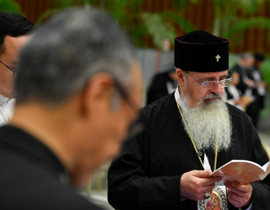 Orthodox priest praying